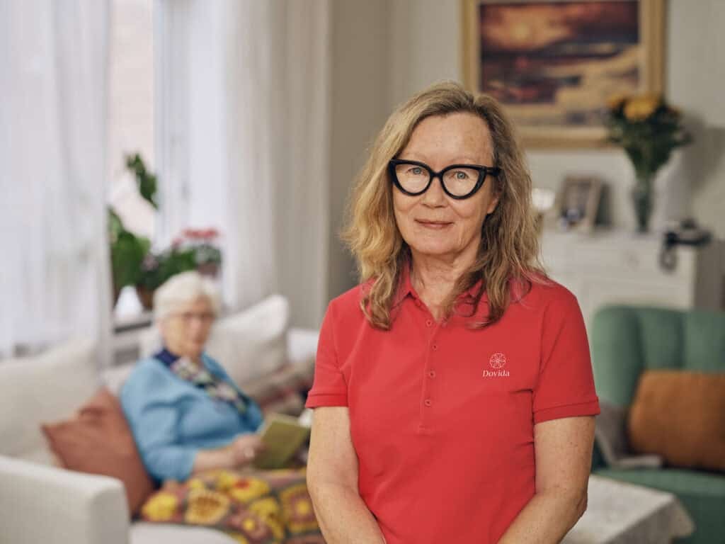 Carer smiles after cleaning home