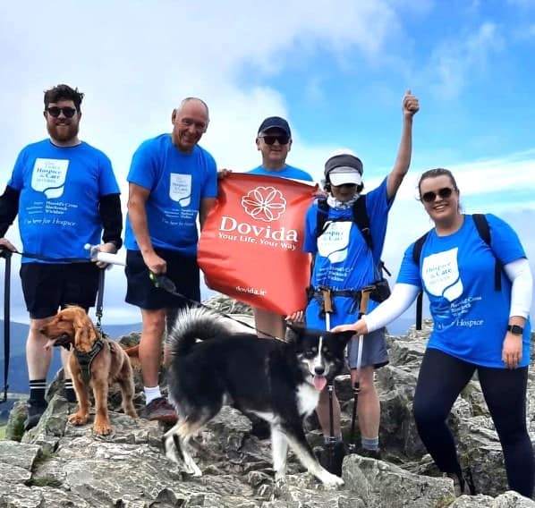 Patrick Tunney, Michael Lowe, Brian Fawsitt, Carmel McCaffrey, and Sarah Donohoe of Dovida Wicklow at the summit of the Great Sugar Loaf