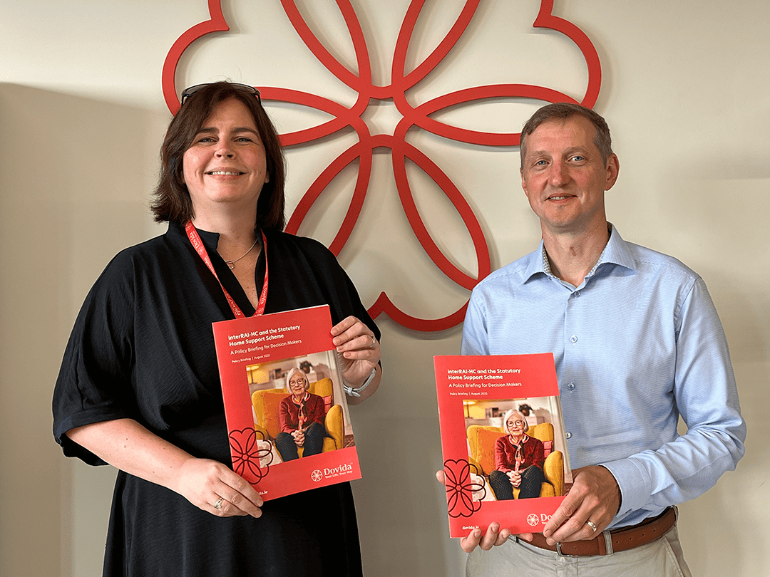 Kathy McLoughlin and Michael Wright holding the policy briefing