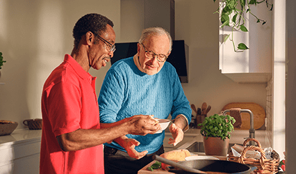 Carer helps client cook his dinner as part of HSE home support service