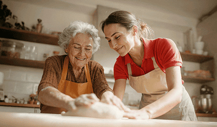 Live-in Caregiver helps client make home made bread