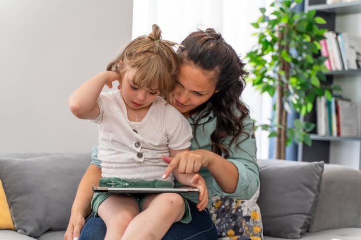 Dovida Autism Support Services - carer comforts young girl